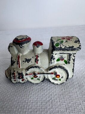 Antique cast iron salt or pepper shaker w hand-painted folk art designs